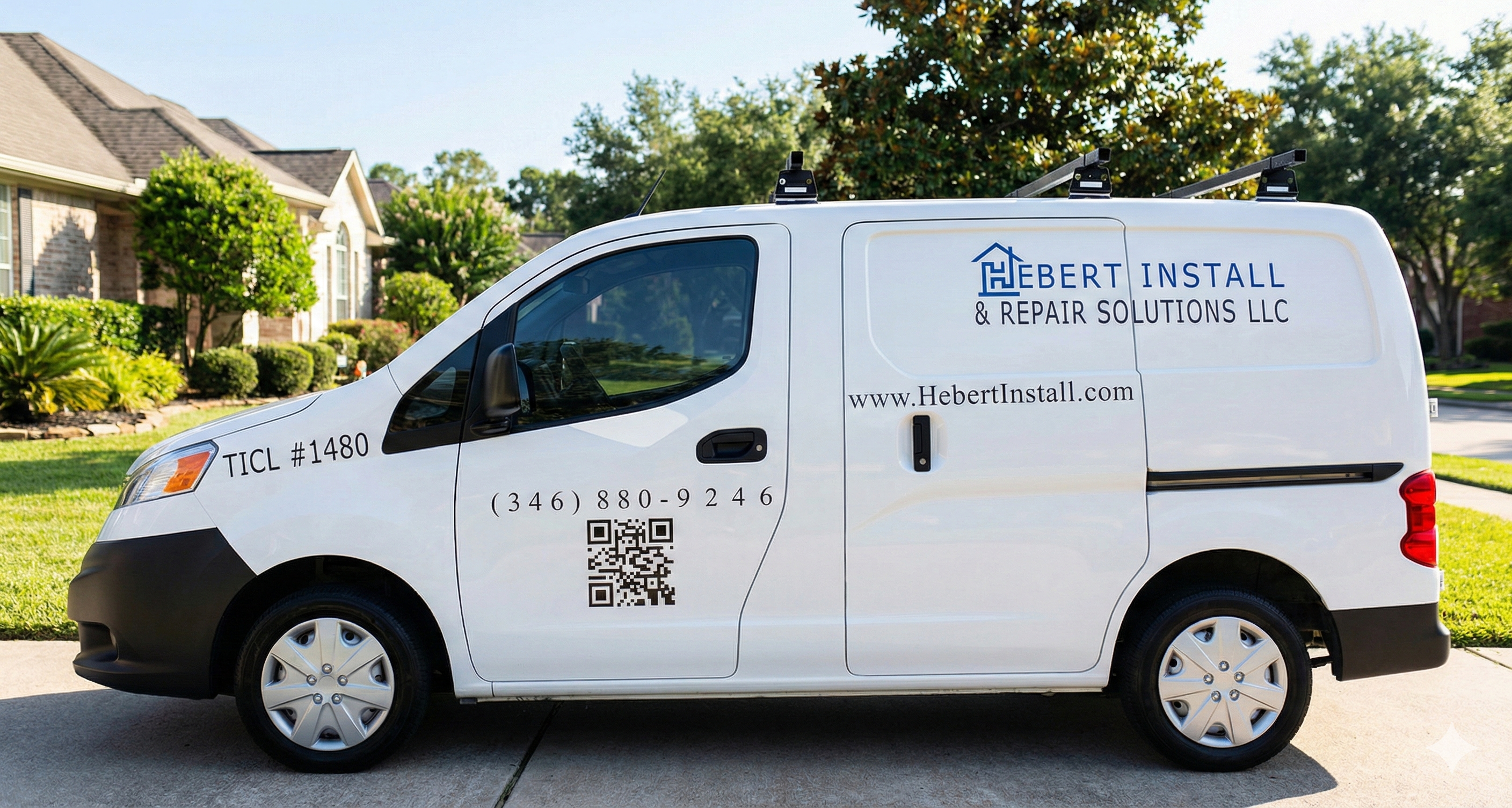 Picture of company cargo work that is parked in a residential driveway displaying the  company number, URL, and logo.